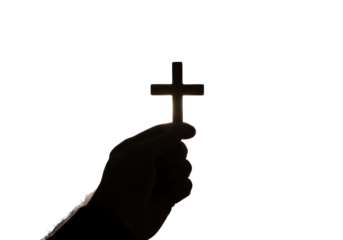 Isolated hand silhouette holding a religious cross Christian crucifix spiritual symbol faith