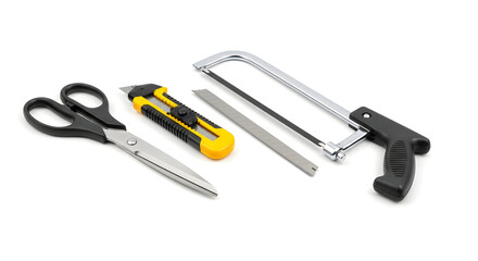 A Collection of Sharp Tools for Cutting and Crafting Scissors, Utility Knife, Hacksaw, and Metal File