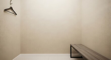 Empty changing room with a hanger and bench.