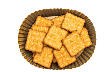 Heap of square Wholemeal salt crackers isolated on white background, top view.