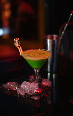 Editorial image of a street view showing a cafe exterior with tables and chairs outside. Concept of European city lifestyle, dining, and tourism.