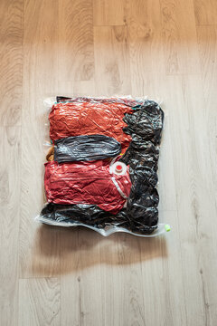 Clothing packed in vacuum compression travel bag