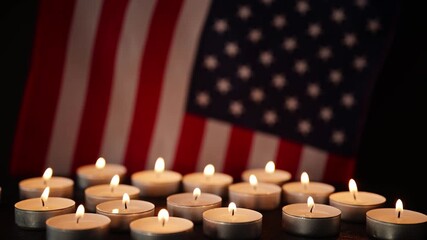 United States flag with candlelight, symbolizing tribute, respect, and national pride. Great background for Veterans Day, Memorial Day, and patriotic remembrance events. - Powered by Adobe
