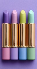 Four pastel lipstick tubes arranged on a purple background