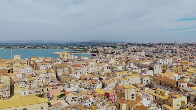 Aerial Drone Wide Shot Over Isola Di Ortigia, Syracuse, Sicily, Italy On A Bright Summer Day.