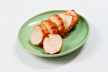 Baked Chicken Breast on green ceramic plate.