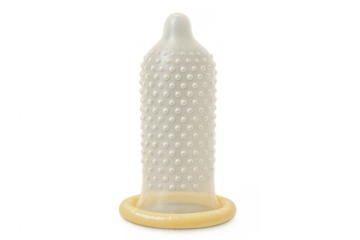 Rolled dotted condom on transparent background promoting safe sex