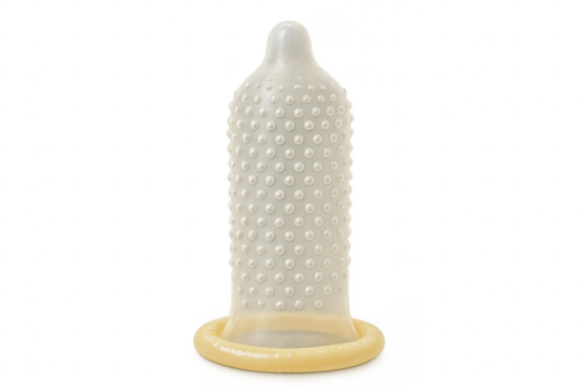 Rolled dotted condom on transparent background promoting safe sex