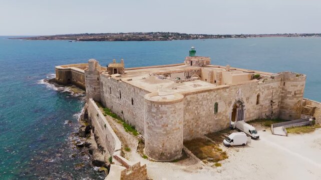 Aerial Drone Low Pass Over Castello Maniace On Ortigia Island In Syracuse, Sicily, Italy On A Bright Summer Day.