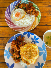 Rice topped with stir-fried pork and basil, Rice topped with stir fried minced pork and basil with Fried egg