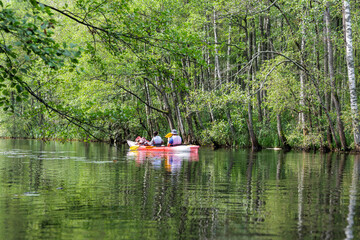 Kayak Team in a Green River