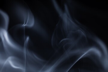 Blue Smoke Swirls on Dark Backdrop, Abstract Misty Vapor in Motion, Atmospheric Background, Flowing Soft Smoke, Dreamy Blue Haze