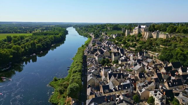 Backward drone panorama fly over the Chinon town with Forteresse Royale de Chinon medieval castle, Indre-et-Loire, France.