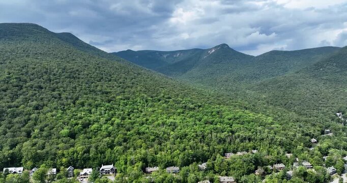 Drone view of houses in the White Mountains of New Hampshire during summer