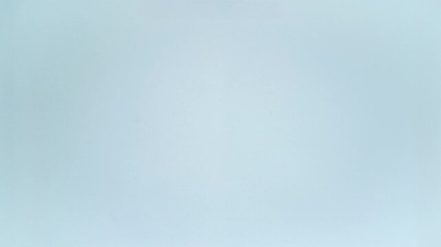 Pink pencil case packs colorful stationery in stop motion on light blue, leaving wide copy space, then reversing as a loop
