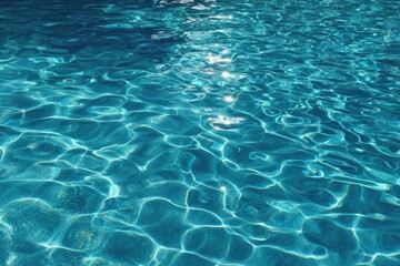Obraz premium Rippled, blue water shimmers with sunlight, creating abstract patterns. Reflections dance on the surface, hinting at depth and movement