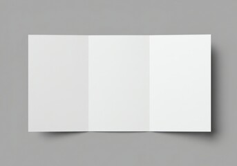 Fototapeta premium Unfolded blank white trifold brochure on a gray background perfect for design