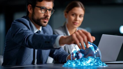 Businessman businesswoman startup fundraising event globe laptop digital projection global connection innovation modern office - Powered by Adobe