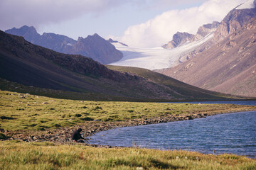 mountain lake with a view of a snow-capped peak - Kyrgyzstan, Tien Shan, Central Asia