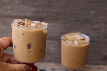Iced coffee on wood background
