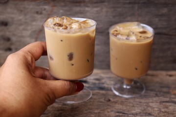 Iced coffee on wood background