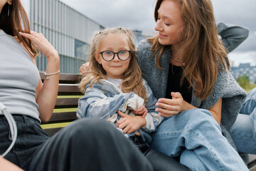 Happy parenthood, portrait of a European family with a daughter