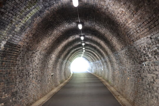 View along a pedestrian and cycle tunnel on a disused railway line