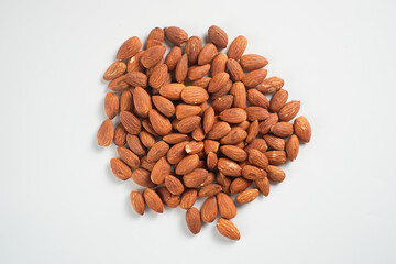 Heap of almonds isolated on white background. Perfect for recipes, articles or any cooking content