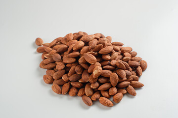 Heap of almonds isolated on white background. Perfect for recipes, articles or any cooking content