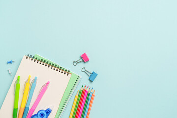 Obraz na płótnie Canvas School supplies or office stationery on blue background.