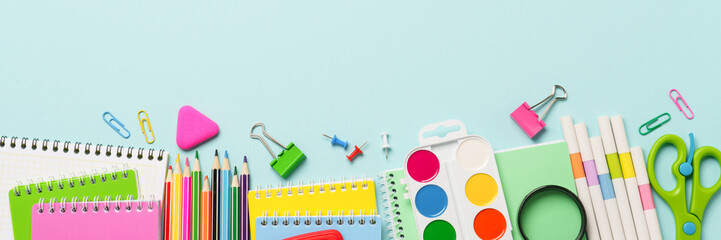 School supplies or office stationery on blue background.