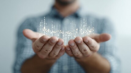 A Caucasian man's hands cradle glowing digital pixels, evoking Techsgiving and World Data Day, embracing future connectivity