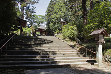 stone stairs and lantern in a shinto temple in shiogama in japan 