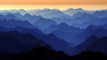 Fototapeta premium Layered mountain ranges in shades of blue.