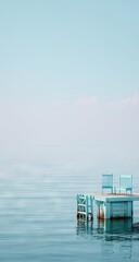 Light blue wooden dock on tranquil water.