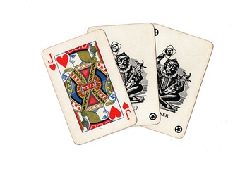 A hand of vintage playing cards showing a pair of jokers and one other card on a white background.