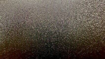 shimmering metallic black glitter texture with radiant sparkle effect perfect for elegant...