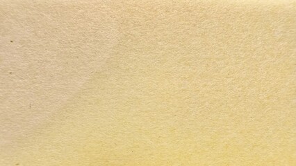 warm beige handmade paper texture with subtle grain and organic surface detail perfect for vintage background or craft design