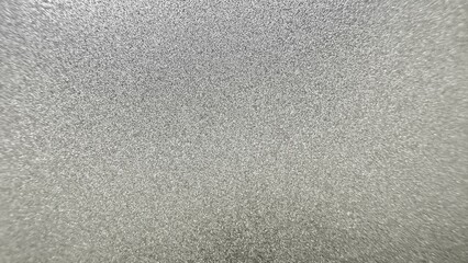 shimmering silver glitter surface with metallic sparkle texture ideal for luxury background or festive digital design