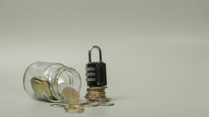 An concept Image of a glass, jar with Money and a lock