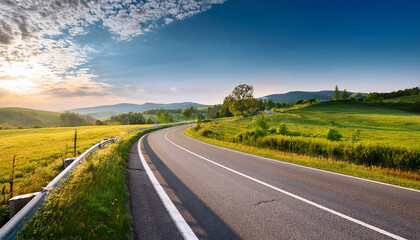 Fototapeta premium a freshly paved smooth asphalt road winding through a picturesque countryside perfect for a road trip