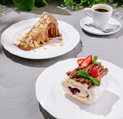 Desserts on white plates with coffee in a cozy cafe setting