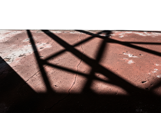 Distorted, elongated, sharp shadows from urban scaffolding cast geometric patterns on weathered dark red concrete, against a bright white expanse with harsh chiaroscuro lighting. Concept of urban