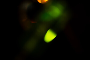 light leak overlay effect with green bokeh blur light leaks,retro noisy film texture light leak flare on black background,grunge film burn texture with light leaks,old film strip