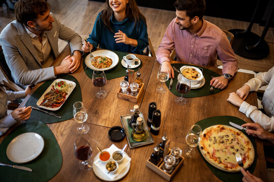 Business People Meeting with Food and Wine in Restaurant