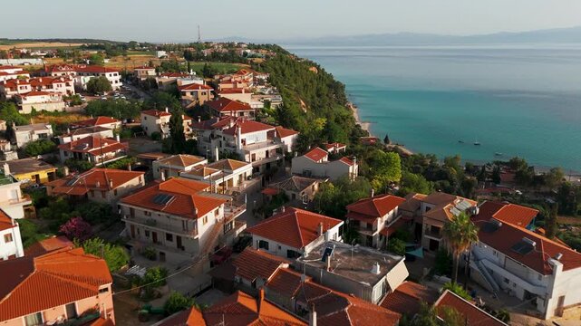 Aerial Drone Shot Flying Over Afytos Coastal Town On The Greek Coast, Kassandra, Halkidiki, Greece At Sunrise.