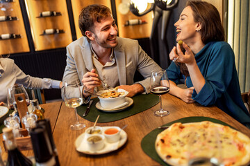 Colleagues Enjoying Lunch with Food and Wine at Restaurant