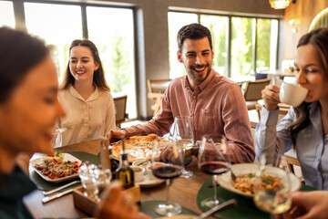 Colleagues Enjoying Lunch with Food and Wine at Restaurant