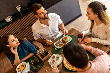 Business People Meeting with Food and Wine in Restaurant