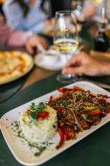 Spicy Chicken with Vegetables and Rice in Restaurant